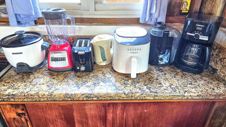 KITCHEN ITEMS:  Rice cooker, Blender, Toaster, Hot Water Kettle, Air Fryer, Juicer and the ever necessary Coffee Maker.   We include Coffee, Salt, Pepper and Sugar as condiments.