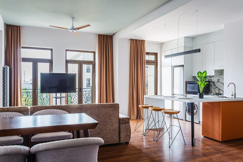 Luxury Apartment, Courtyard View | Living area | Flat-screen TV