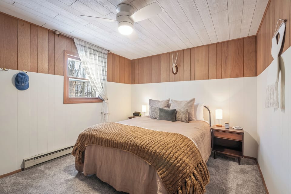The primary bedroom features a queen bed.