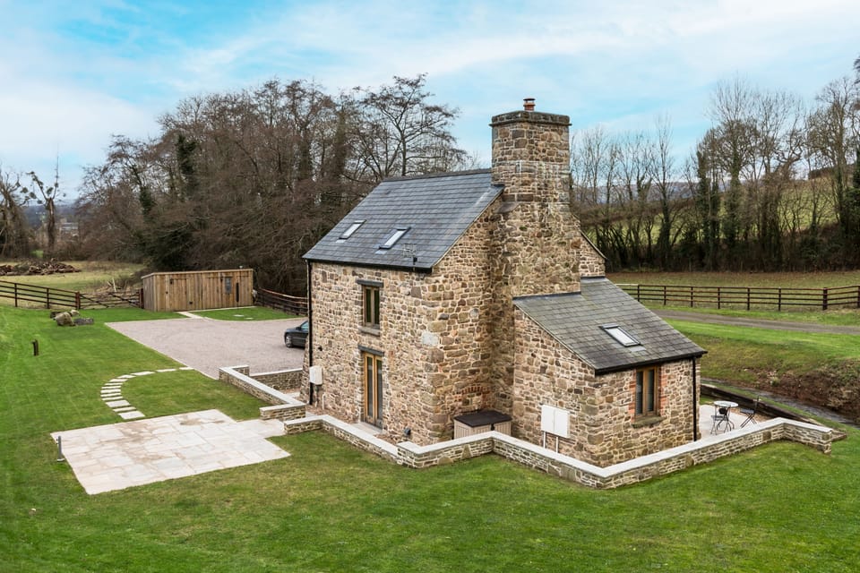 Expansive lawned garden surrounds Shepherd's Cottage, Usk, Monmouthshire