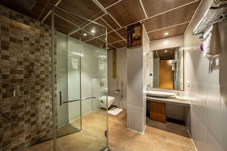 Shower, free toiletries, slippers, towels