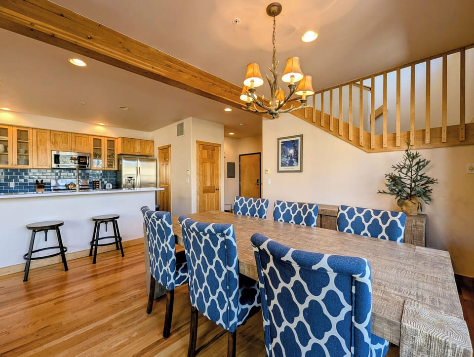 Gather around this elegant dining table for memorable meals together, while the chef creates culinary magic in your fully-equipped kitchen nearby.