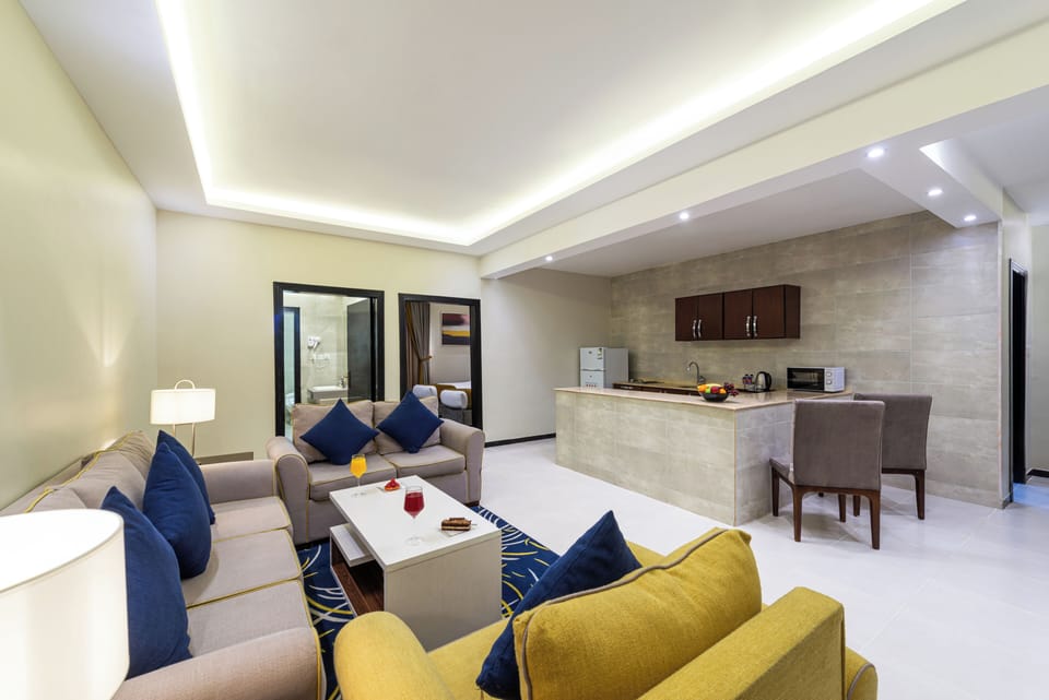 Family Suite | Living area | 50-inch TV with digital channels