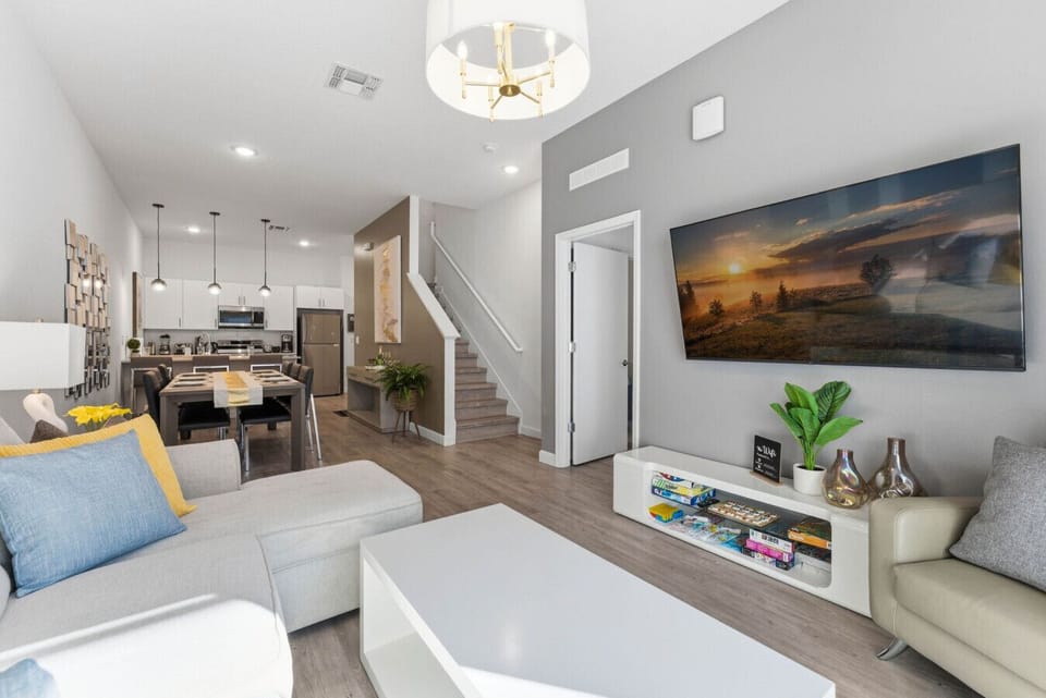 Spacious layout connecting living, dining, and kitchen.