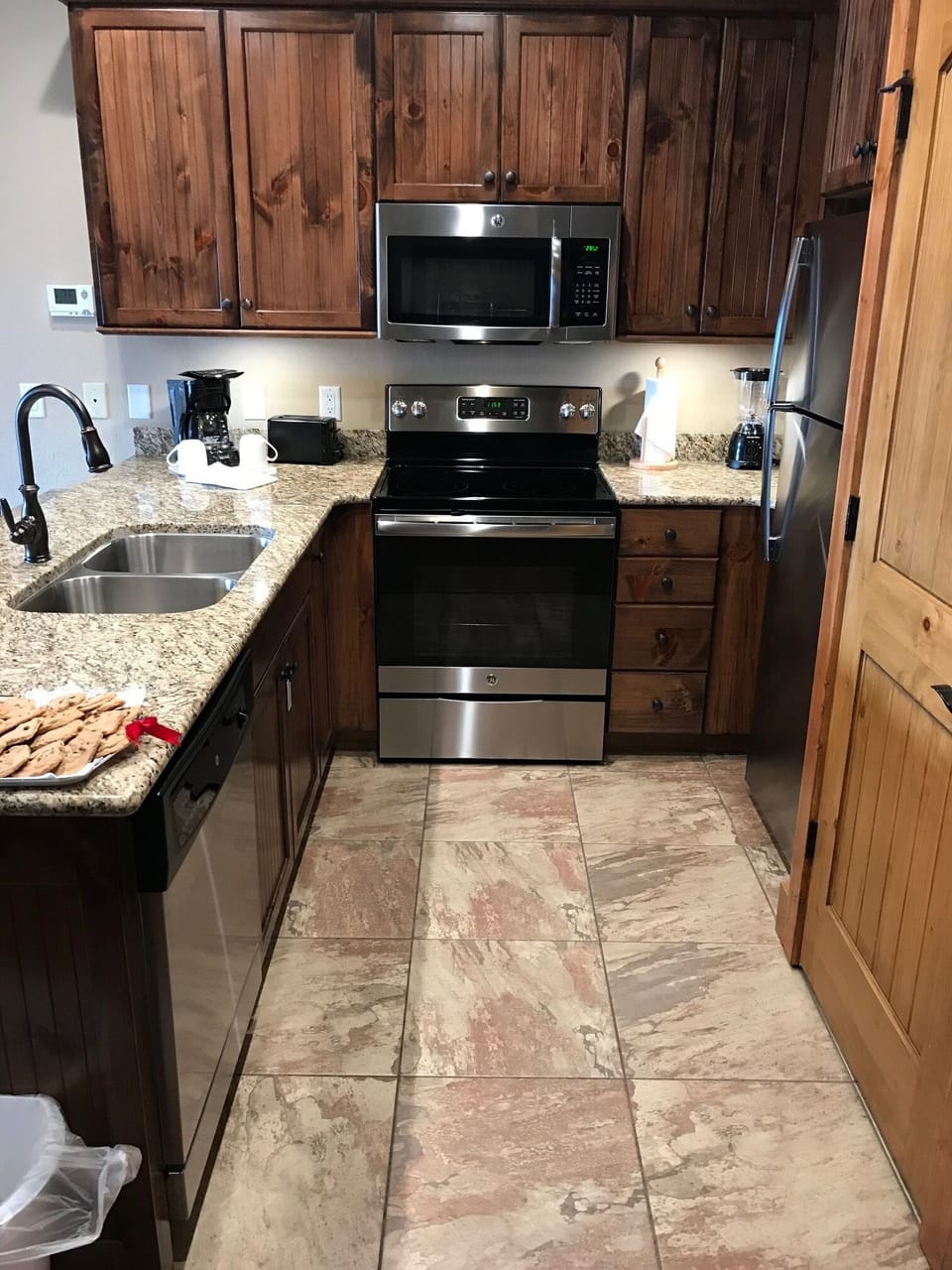 Large unit - Full kitchen with washer/dryer combo on left.