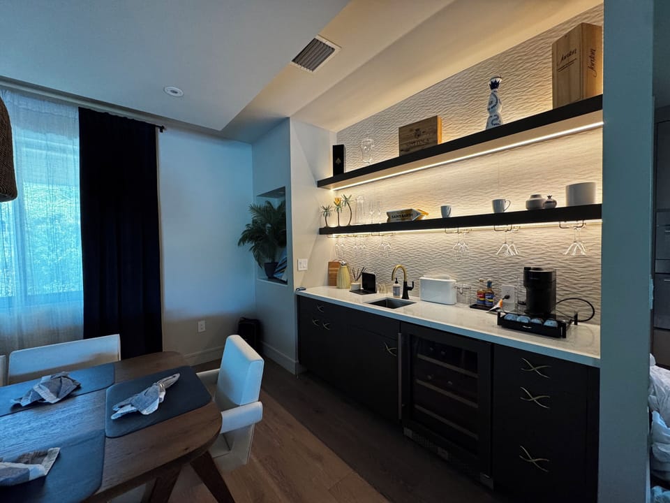 Bar with Nespresso Coffee Station, teas, beverage refrigerator and sink