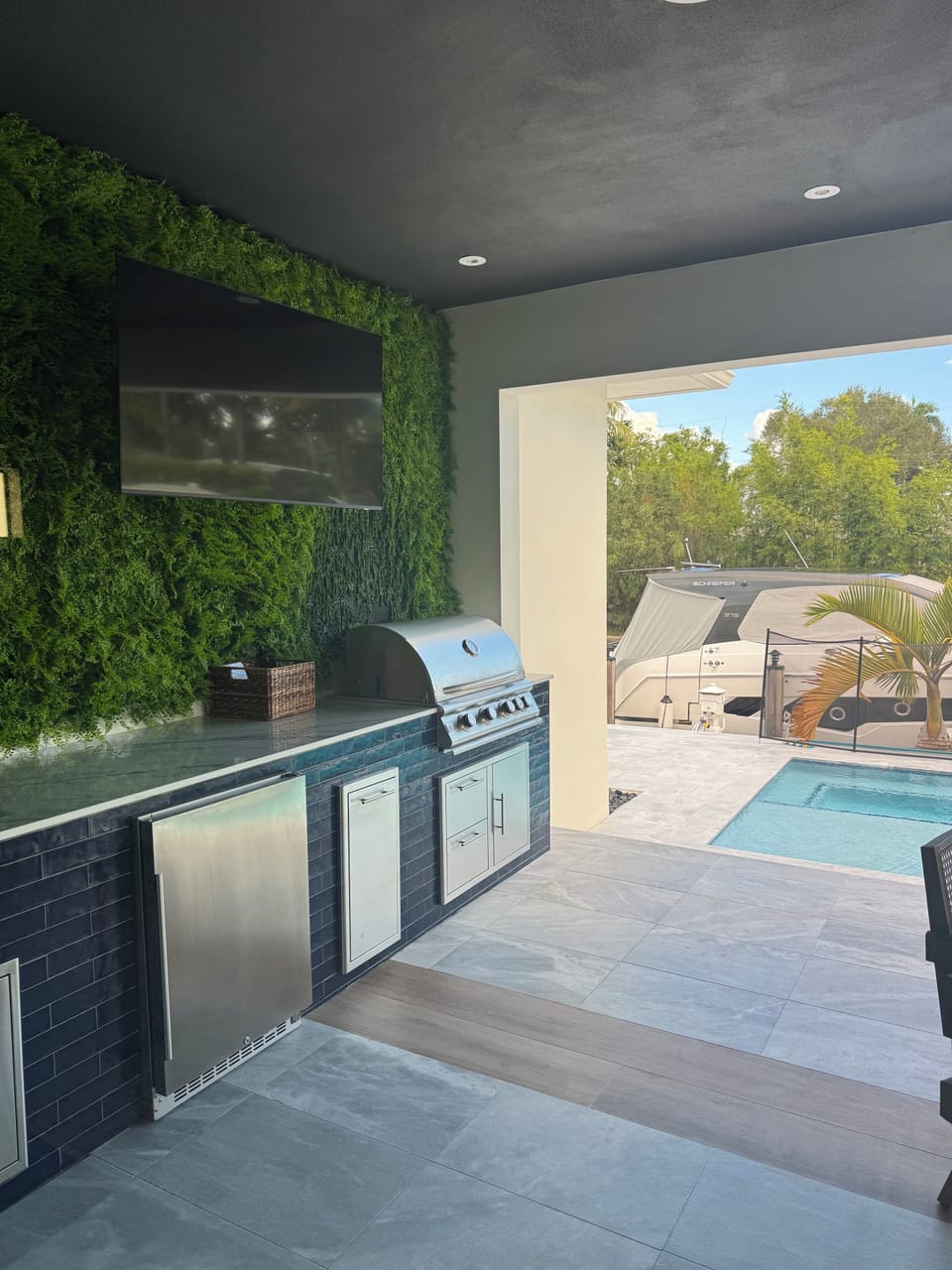 Outdoor Kitchen in Patio overlooking pool and ocean's canal