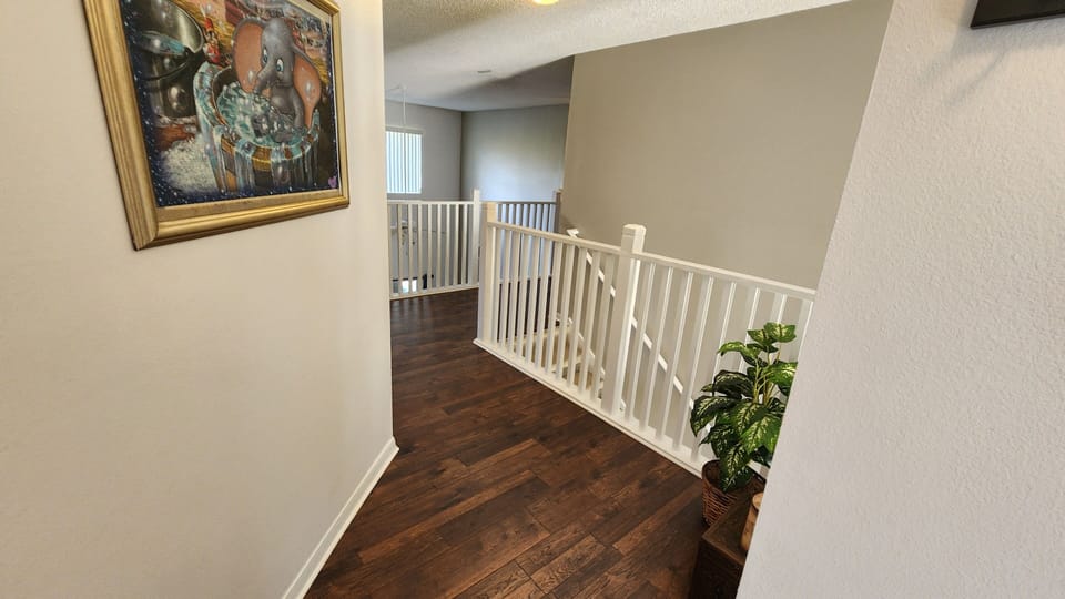 The upstairs hallway now sports gorgeous new flooring.