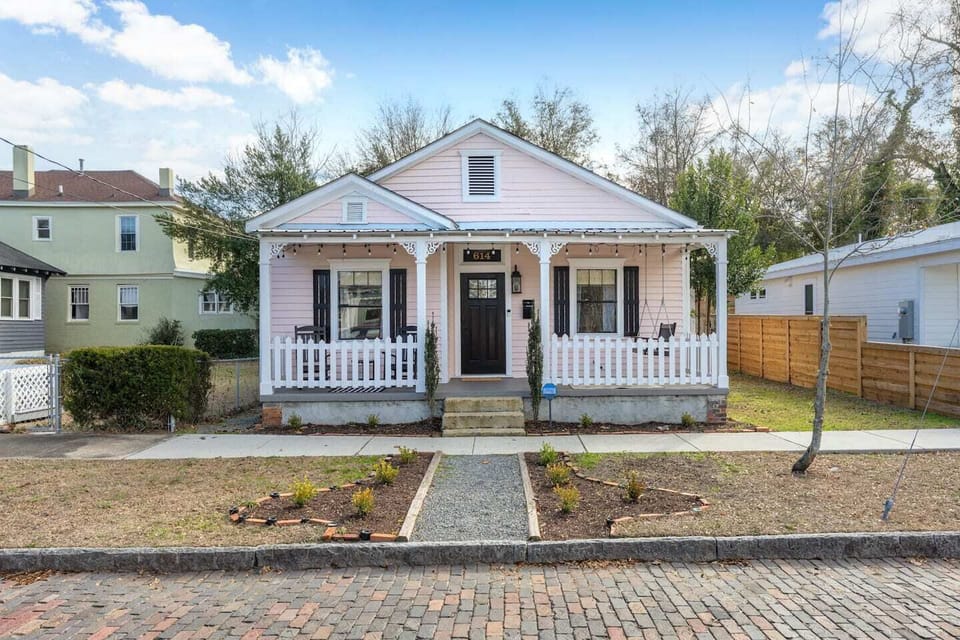 Experience the charm of staying in a unique pink cottage that stands out in the historic district.