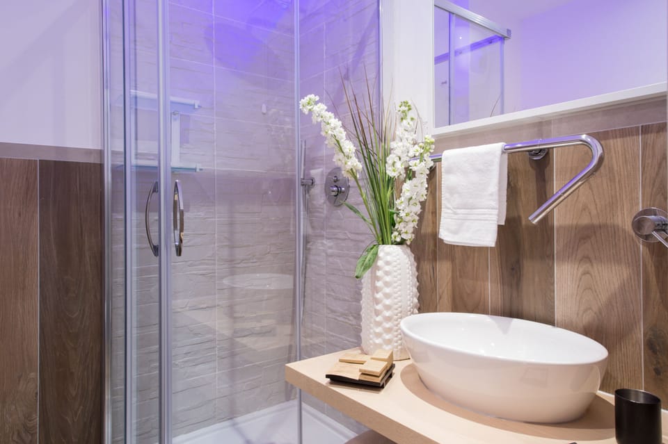 Family Room, Multiple Beds | Bathroom | Shower, free toiletries, hair dryer, bidet