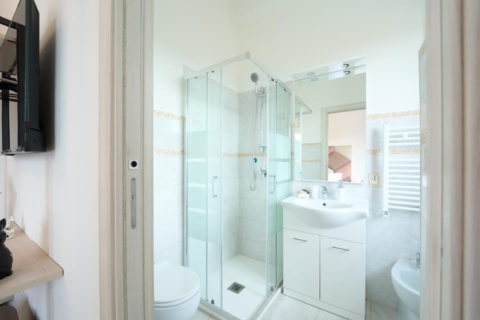 Shower, free toiletries, hair dryer, slippers