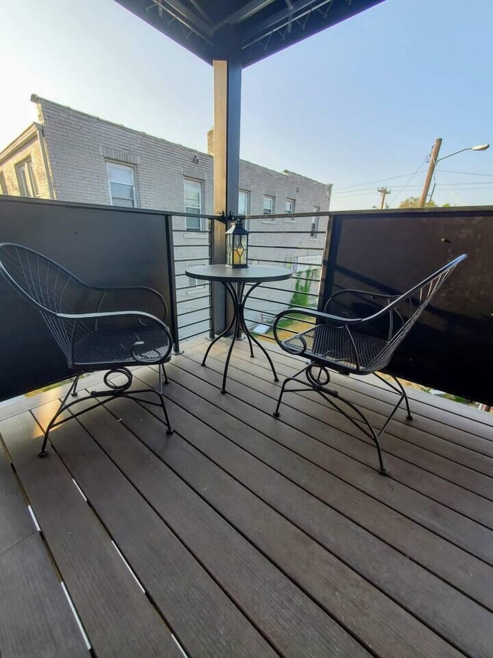 Private deck space just outside your door, located above the shared patio below. 