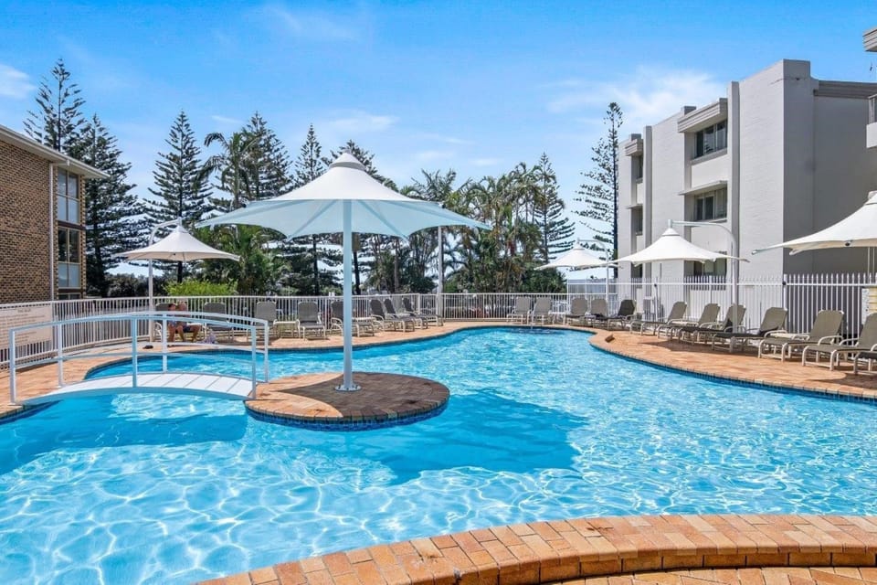 Indoor pool, outdoor pool, pool umbrellas