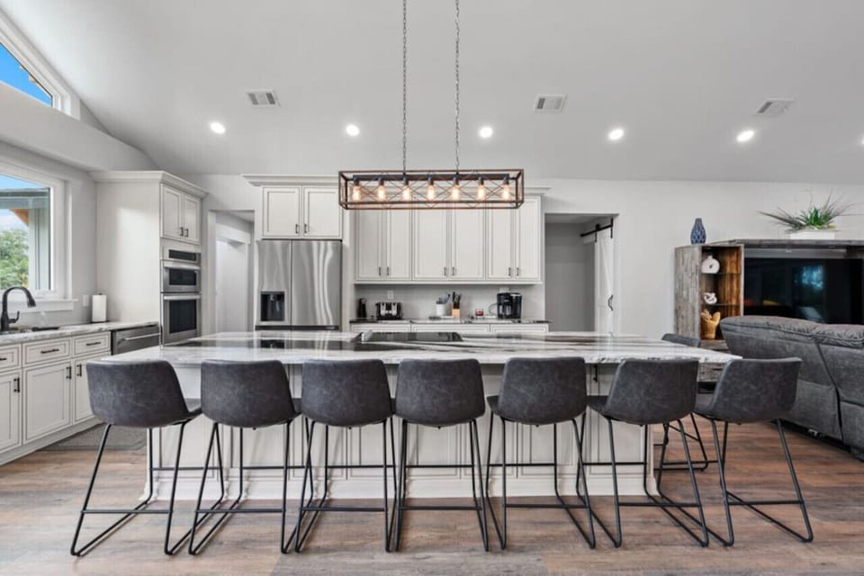 Gather around this stylish kitchen island for casual meals, conversations, or a morning coffee. With ample seating and sleek modern design, it’s the perfect hub for socializing and dining.