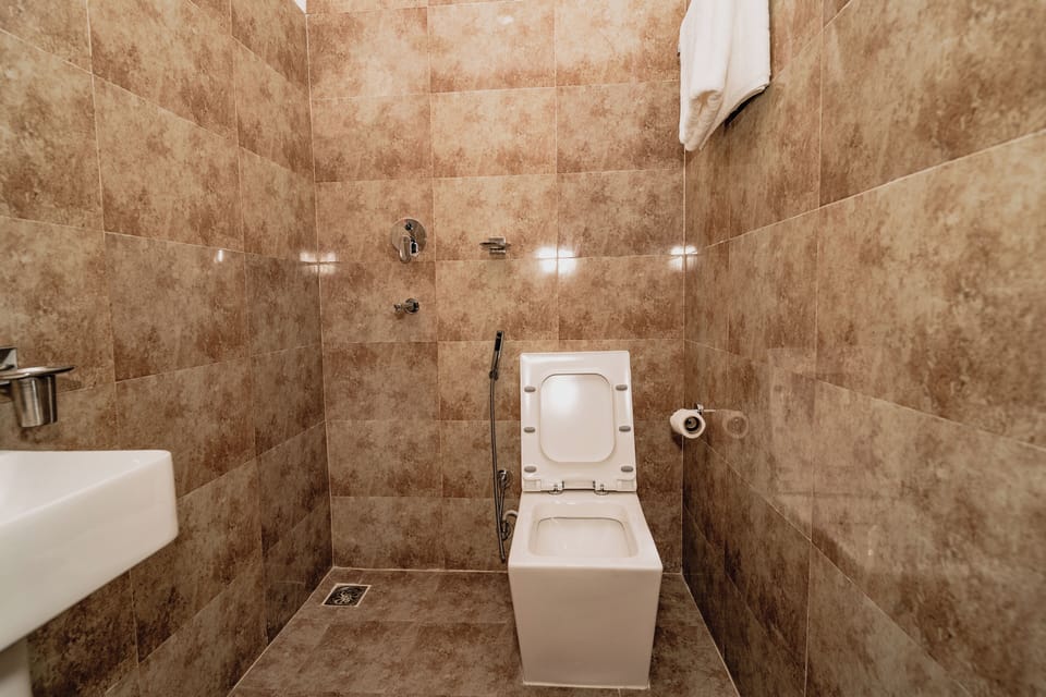 Shower, slippers, soap, toilet paper