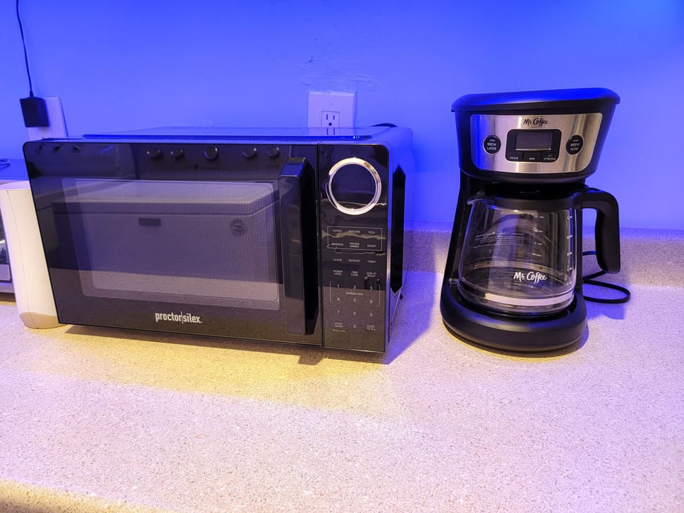 Kitchenette area with Full size fridge and washer and dryer