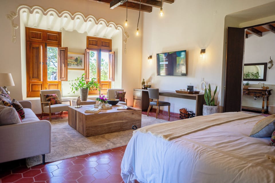 Deluxe Room, Patio | Living area | TV