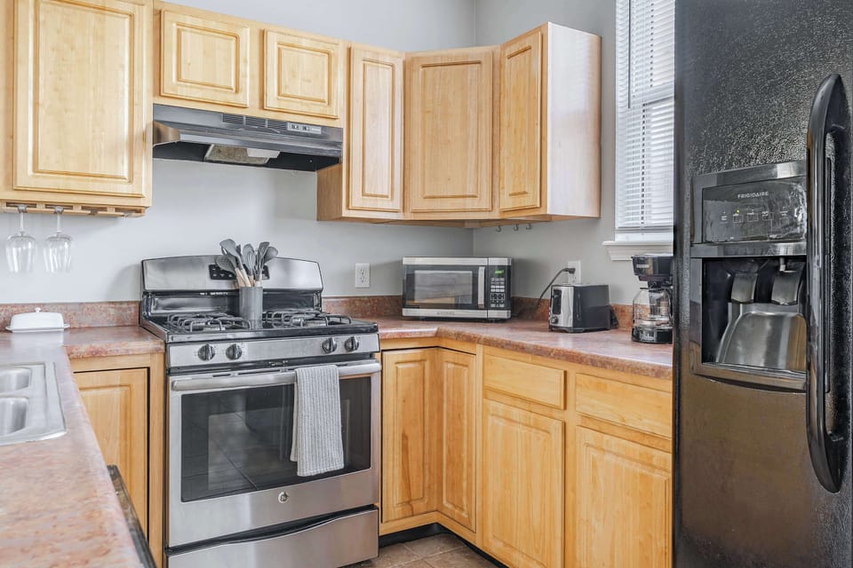 Fully stocked kitchen with 12 cup coffee maker and complimentary coffee. 