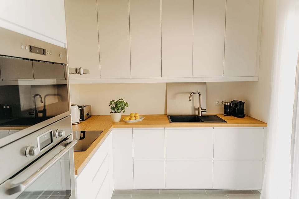 Deluxe Chalet, Garden View | Private kitchen | Electric kettle, highchair