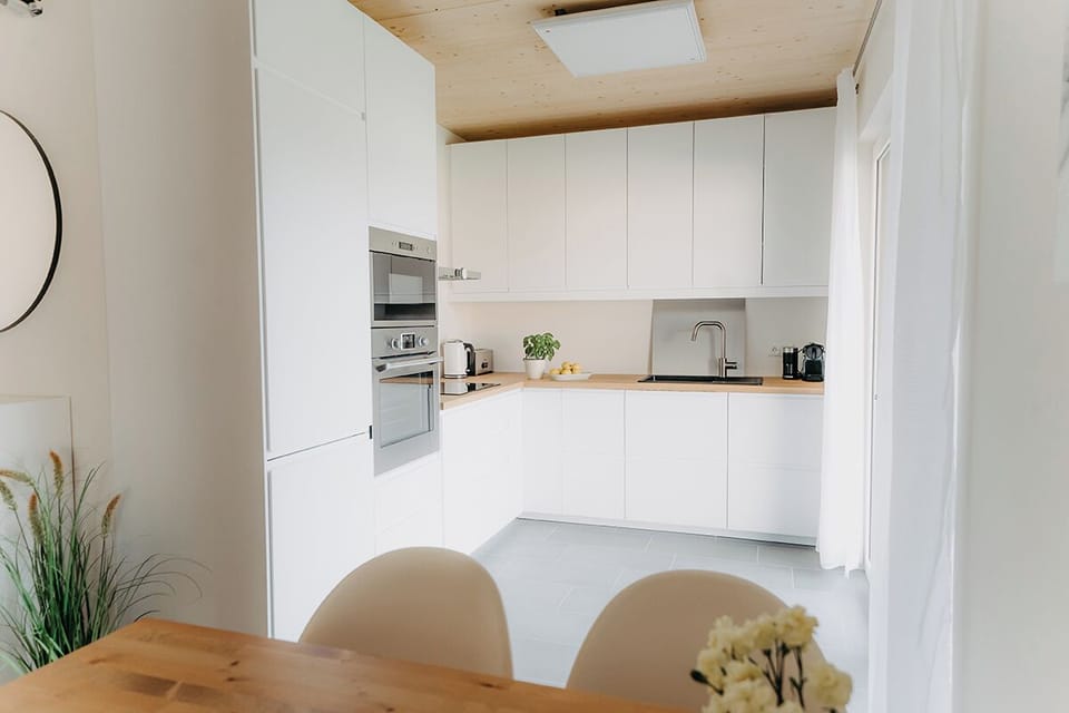 Deluxe Chalet, Garden View | Private kitchen | Electric kettle, highchair