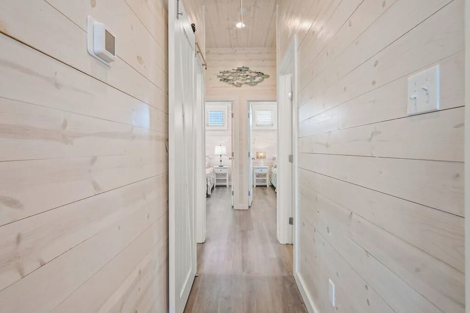 Modern elegance meets functionality in this bright and inviting hallway.