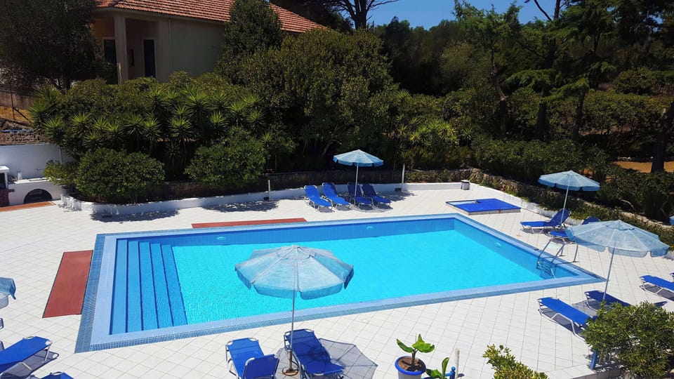 Guest Pool Area with Umbrellas – Shared and Serene

