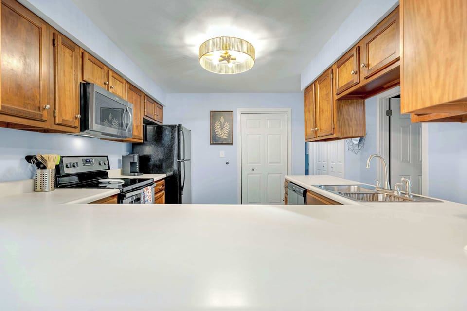The inviting kitchen offers ample space & all the comforts of home