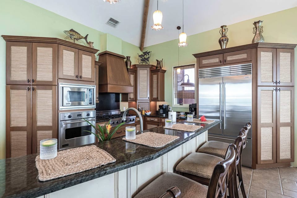 The open kitchen features a sleek and spacious design, perfect for both cooking and socializing.