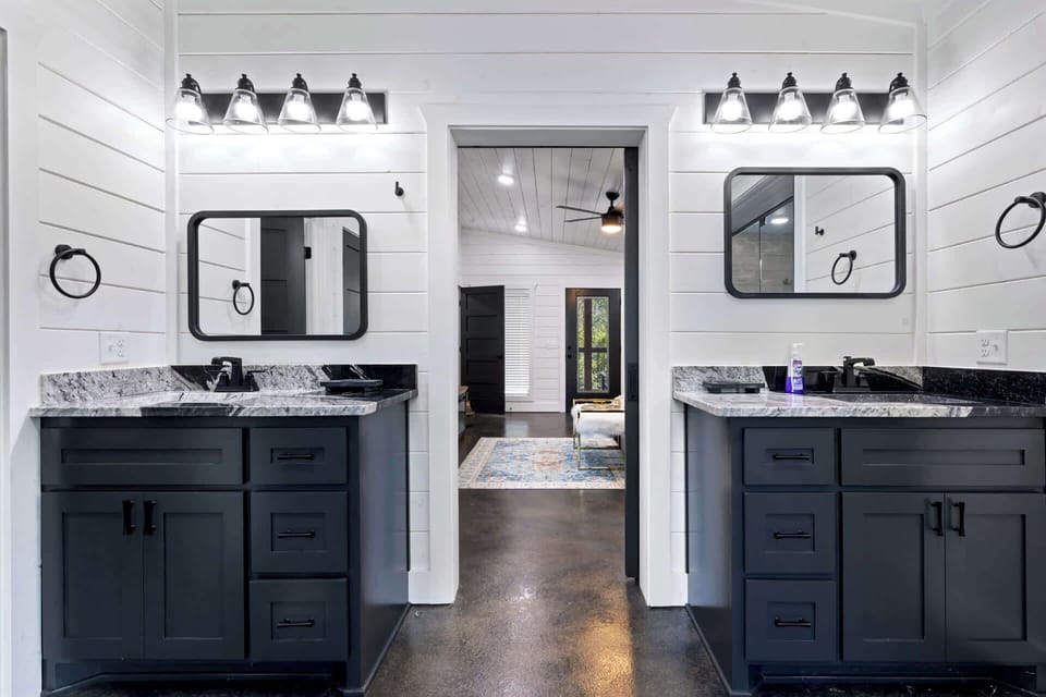 The king ensuite, with dual vanities as well as a glass shower & soaking tub