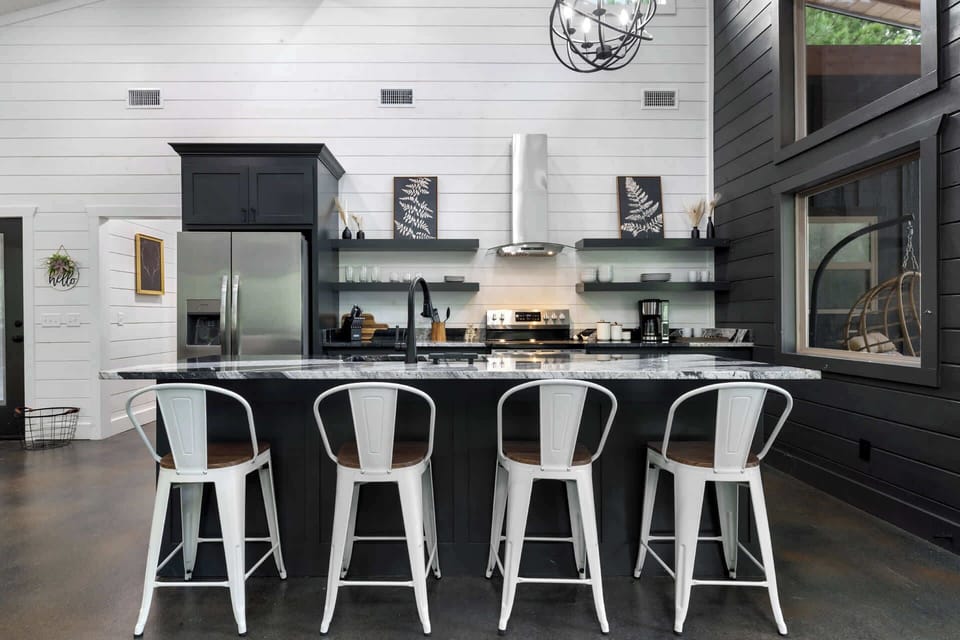 The chic, open kitchen offers ample space & every home comfort