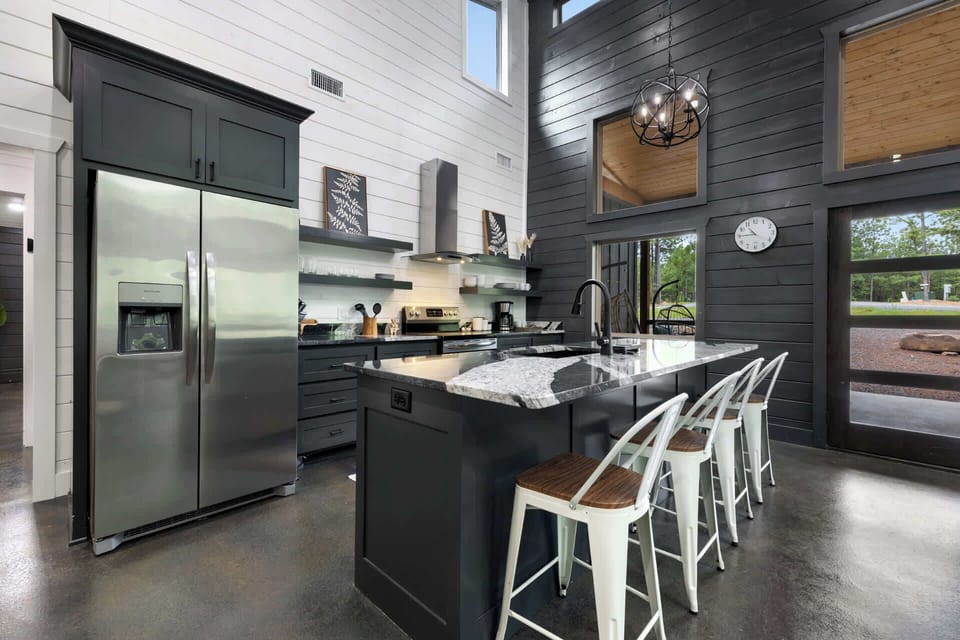 The chic, open kitchen offers ample space & every home comfort