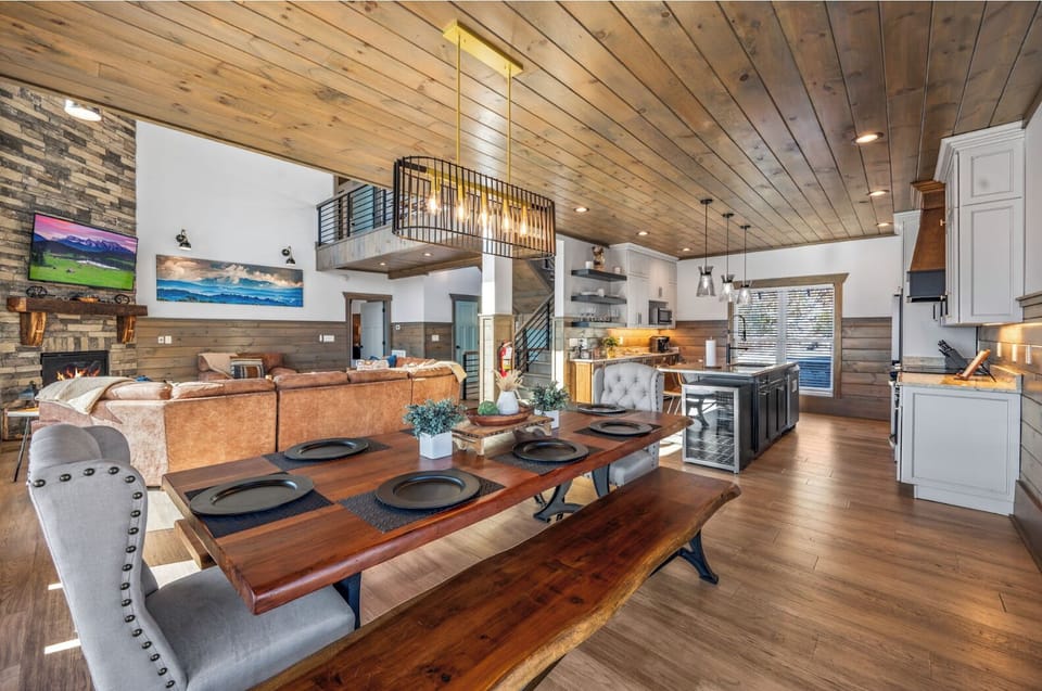 The wood dining table and open floor concept is perfect for entertaining!