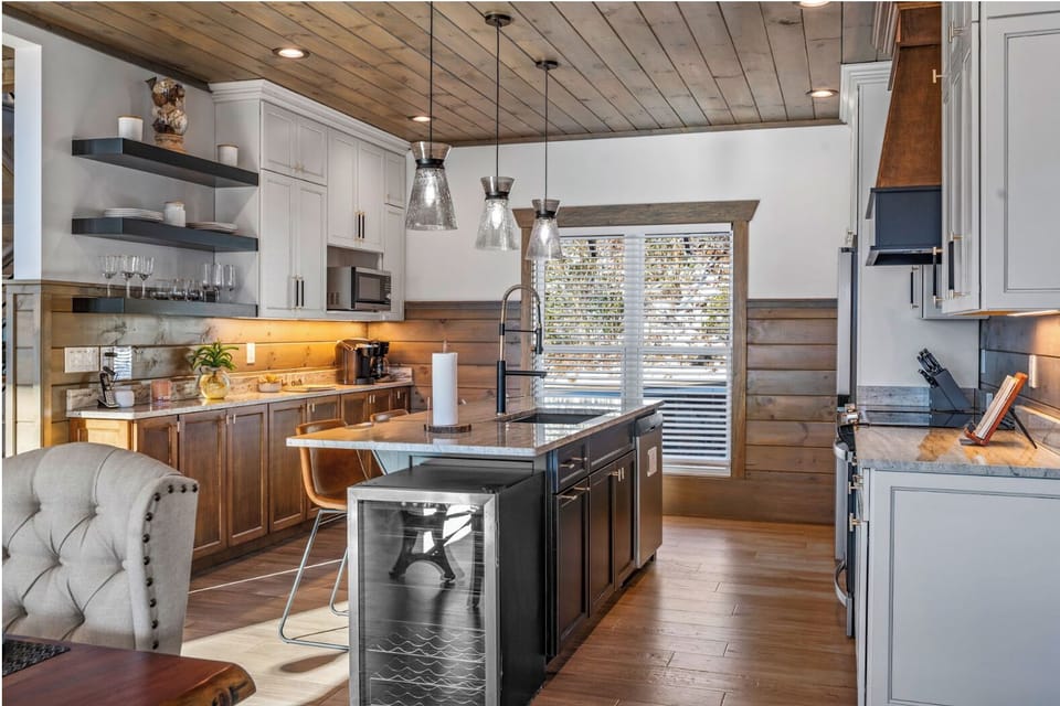 The open-concept kitchen, dining, and living room offer stunning views and more!