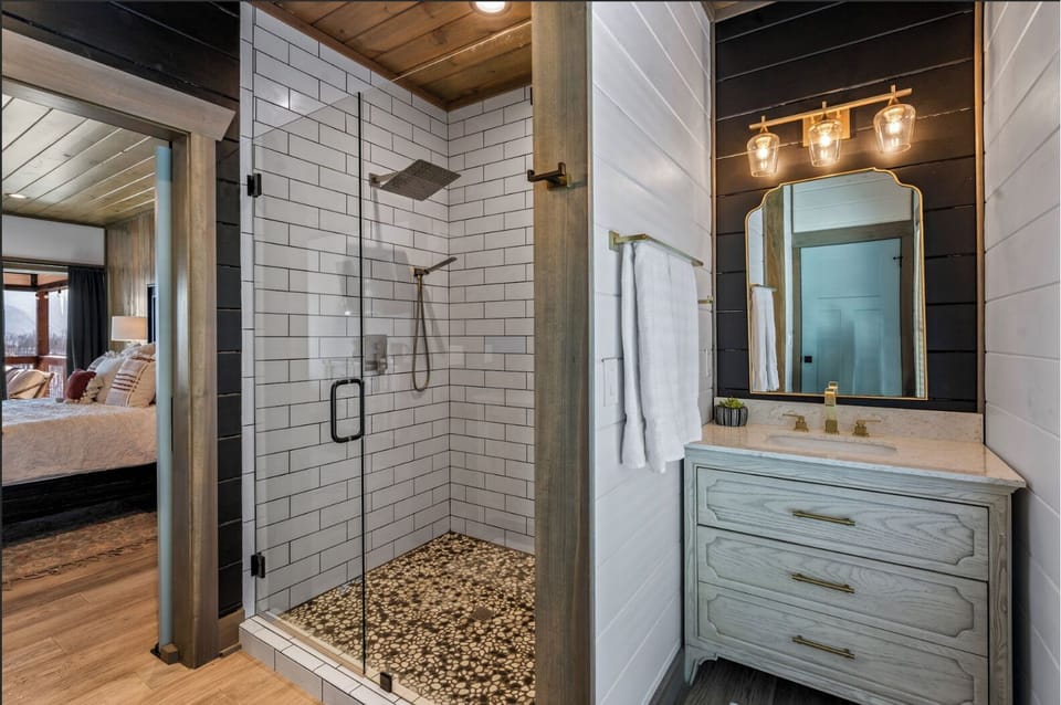 The king bedroom on the main level has a stand-up shower in the bathroom.
