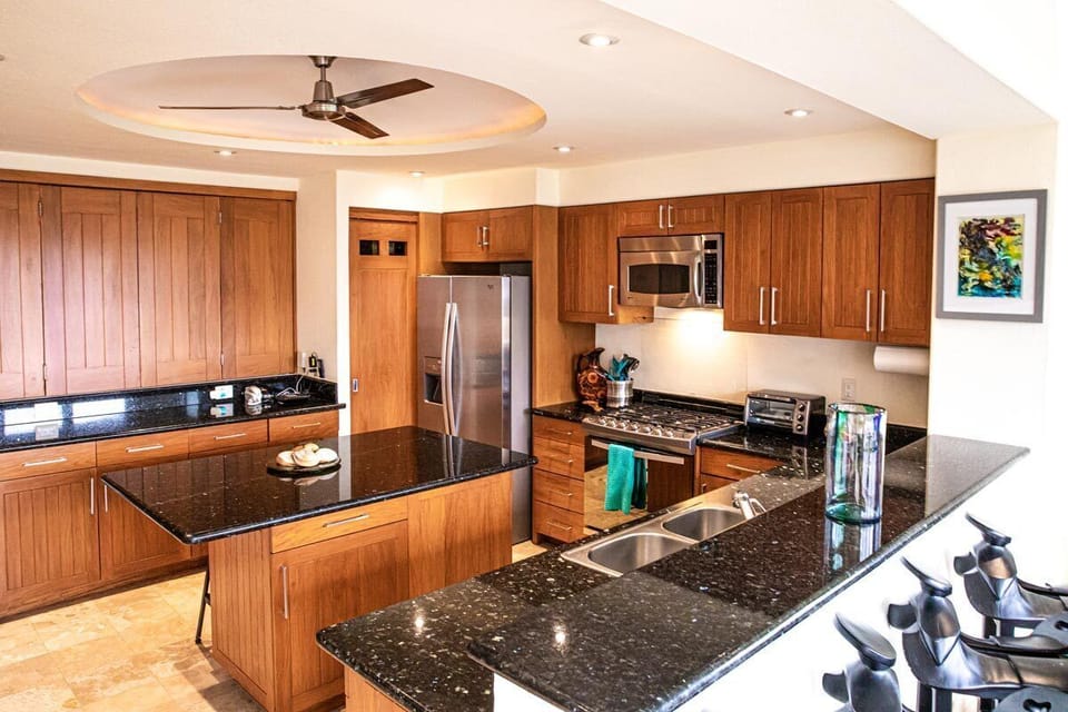 Spacious Kitchen with stainless steel appliances and a large island.