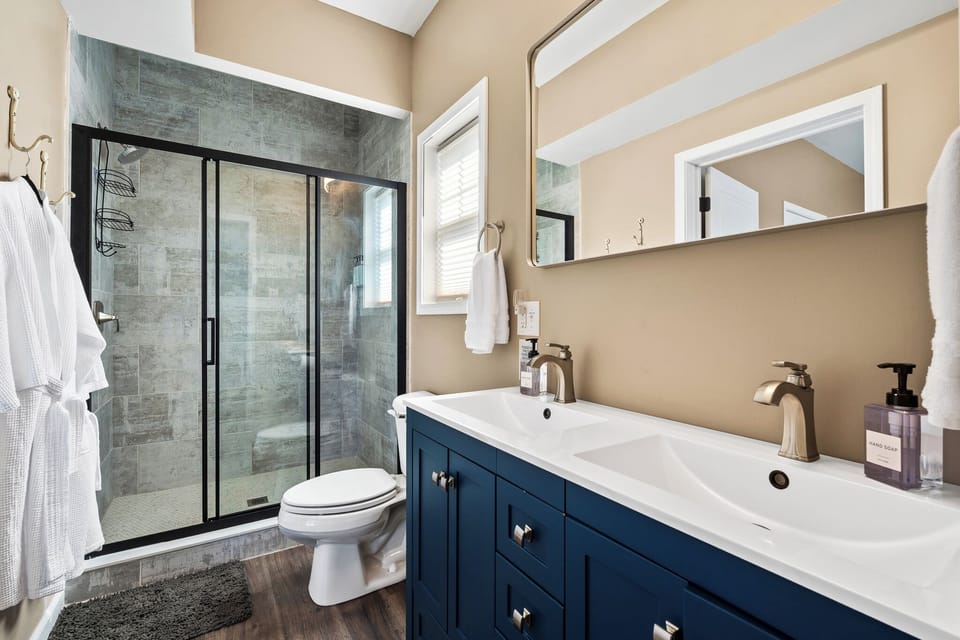 Morning prep will be a breeze at the double vanity and oversized shower in the primary bedroom en-suite.