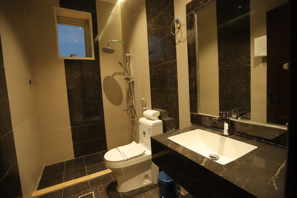 Shower, hair dryer, slippers, towels