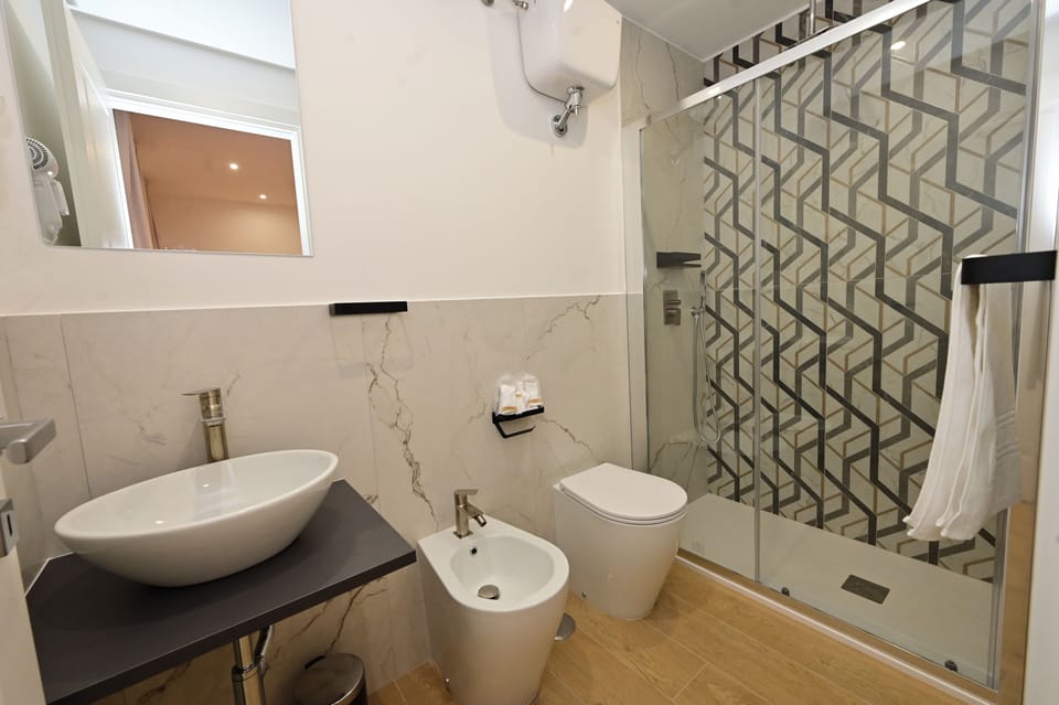Superior Double Room, City View | Bathroom | Shower, hair dryer, bidet, towels