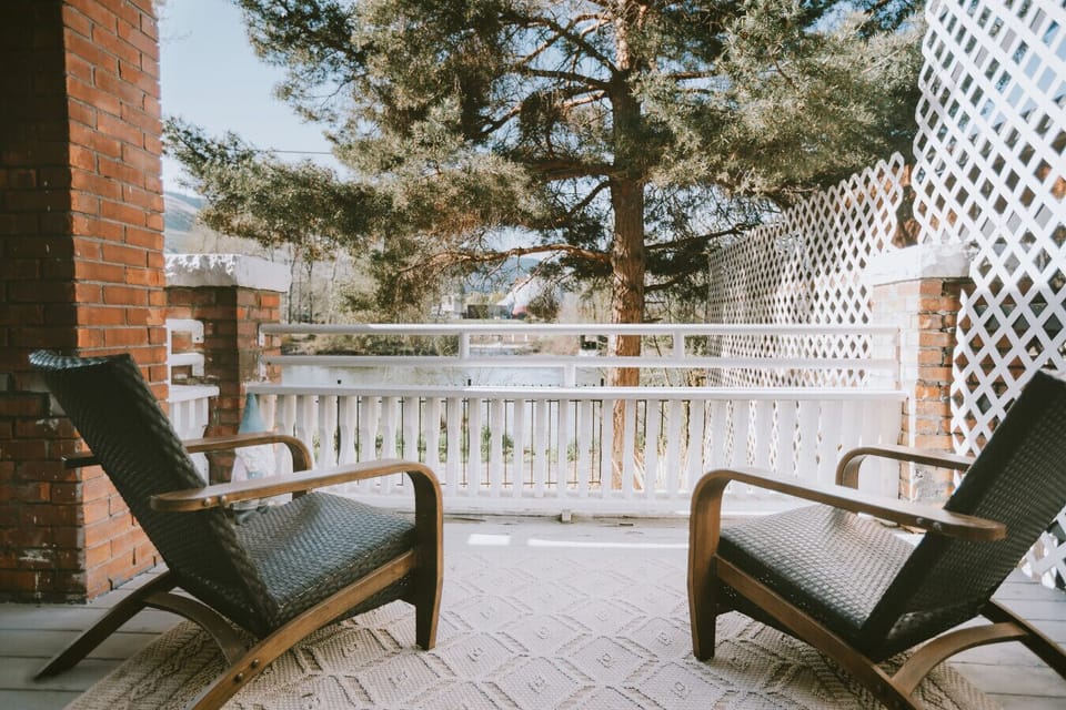 Clark Fork Suite #1- Morning coffee or evening wine, this porch doesn`t care which. The river view is ready either way.