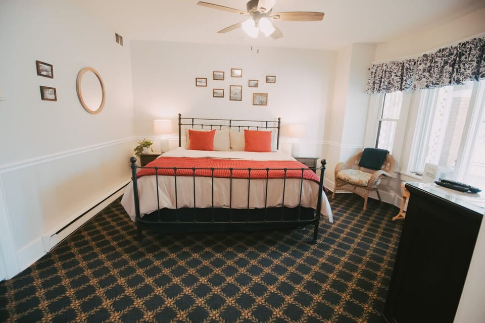 Clark Fork Suite #1- Old-fashioned charm, genuinely good sleep. The iron bed frame and warm throws do most of the talking.