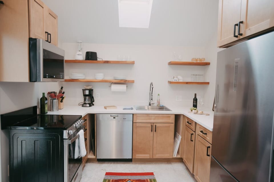 Rock Creek Apartment #6- A skylit kitchen that makes morning coffee a dream.