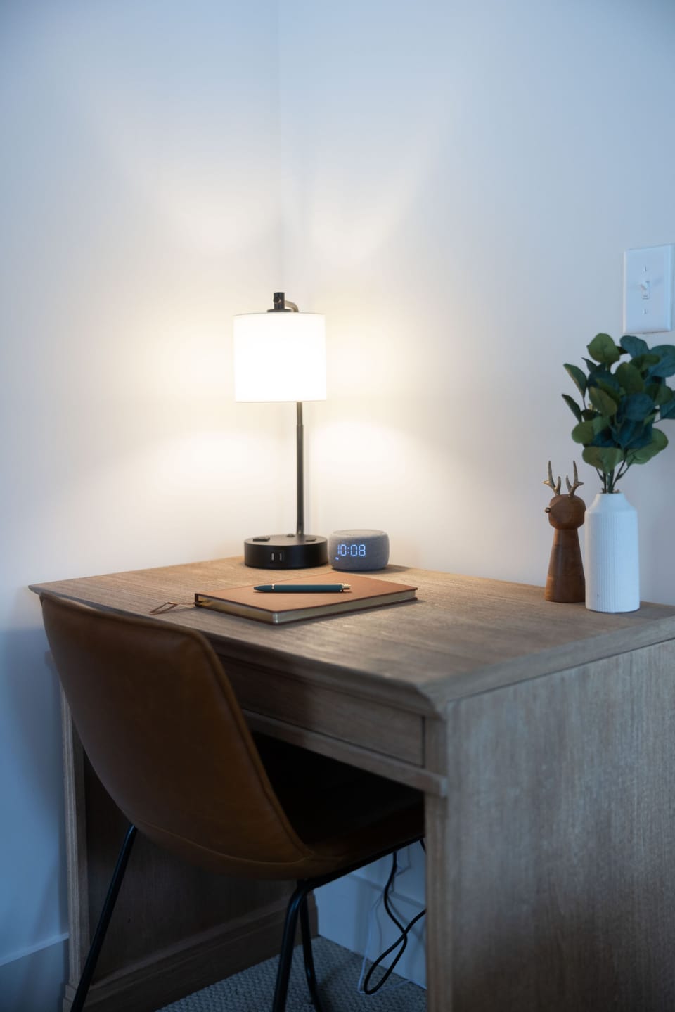 The first floor bedroom features a comfortable desk, perfect for work or relaxation