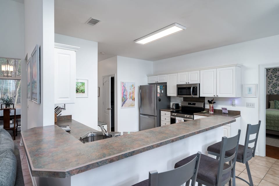 Counter seating for 3 at the "L shaped" kitchen counter