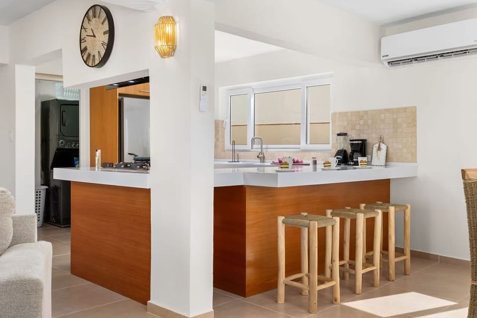 Cook like a pro with state-of-the-art appliances, spacious countertops, and all the essentials. Enjoy your meals at the dining table for 4 or the cozy kitchen bar.