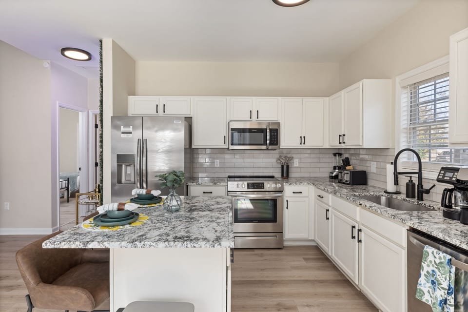 Ample storage and spacious counter spaces in the kitchen