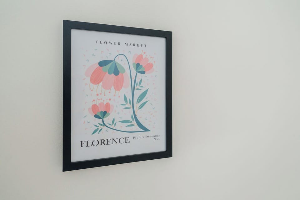 Spacious bright and airy room with a full-size single bed and a junior size single bed.