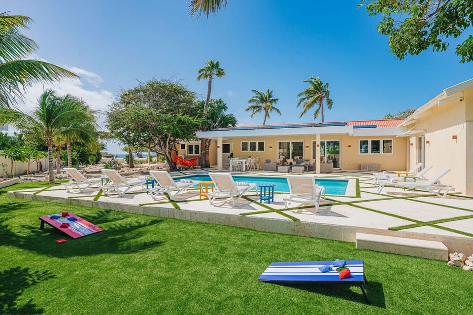 Sun-soaked afternoons begin here — lounge, swim, repeat.
