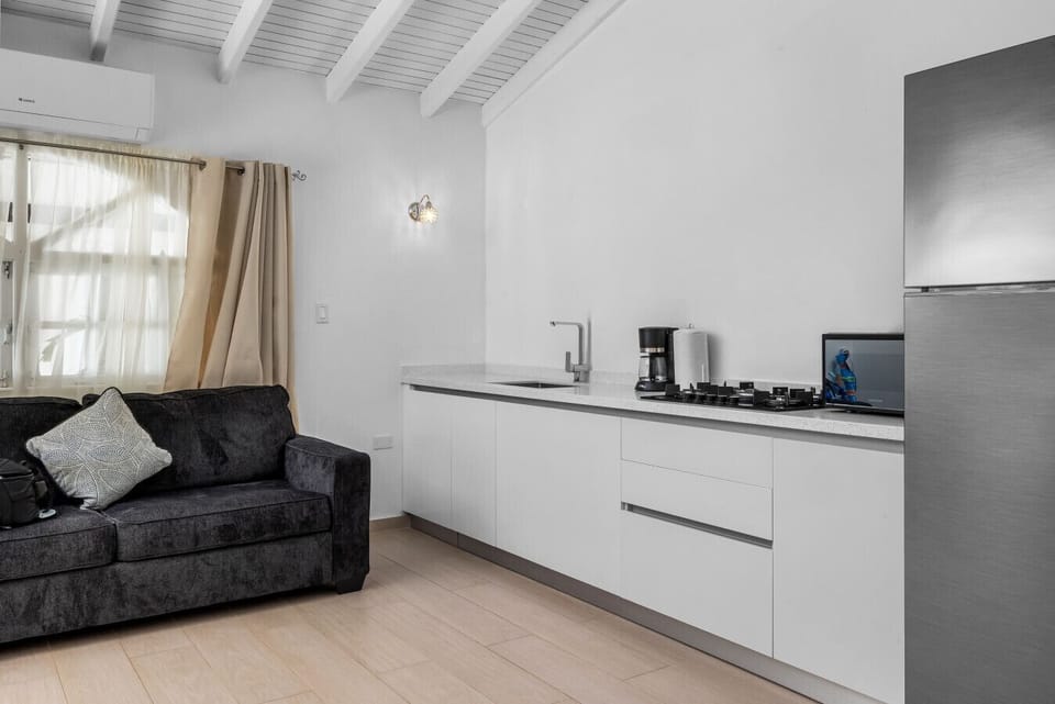 Enjoy a cozy seating area, a fully equipped kitchen for all your culinary adventures, and bright, airy spaces that invite relaxation. Perfect for a memorable getaway!