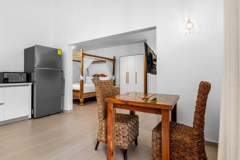 Enjoy meals in this charming nook with a view of your serene retreat!