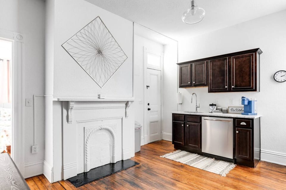 Fully equipped with everything you need, including a dishwasher, sink, oven range, microwave, toaster, and Keurig. A long dining table with seating for two along with ample cabinet space for storage is a plus.
